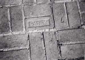 Parry brick in the sidewalk, Lawndale Street. Courtesy of Michael Chesson/ Belmont Public Library.