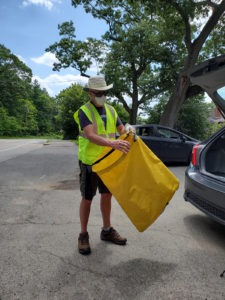 The Litter Guy with trash bag.