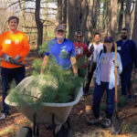 Roger Wrubel and volunteers at Lone Tree hill