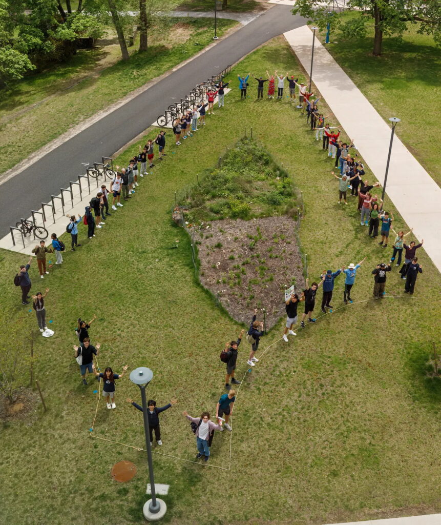 Line of people outlining future Miyawaki forest site