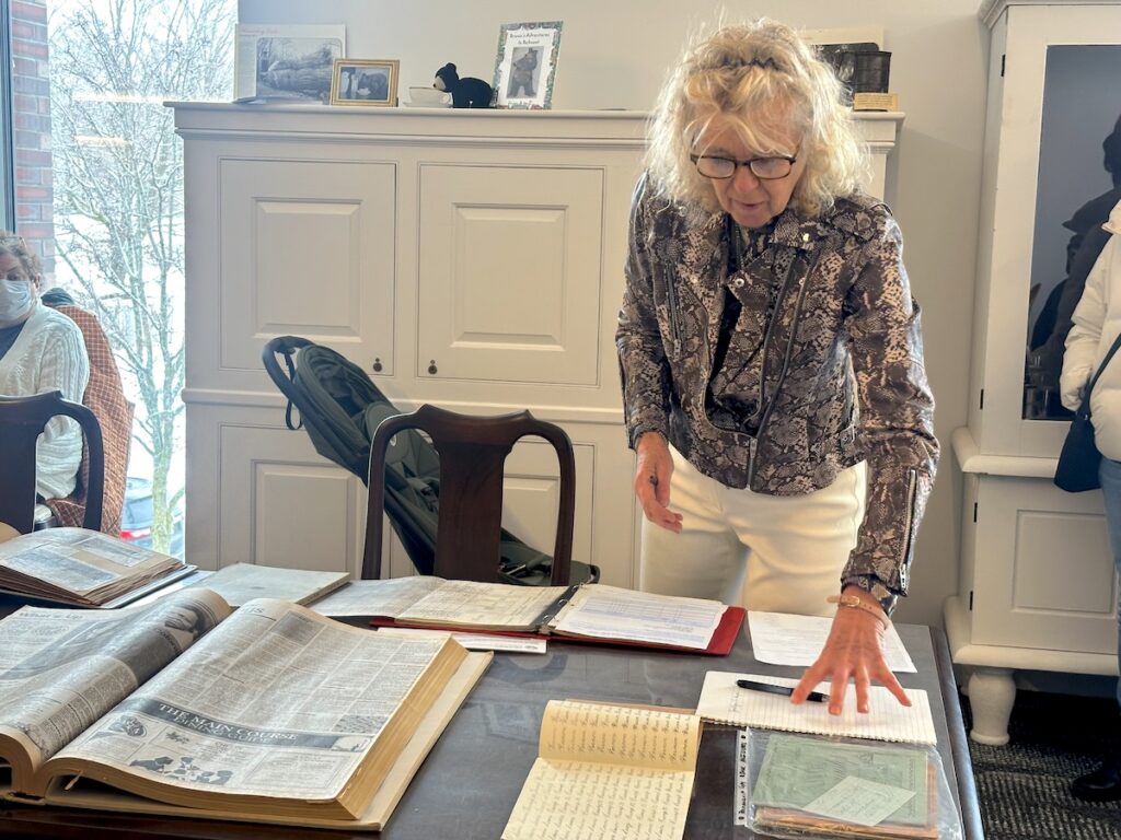 Viktoria Haase displays Belmont Historical Society materials at the Underwood Library